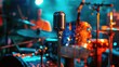 A microphone stands tall amidst a drum kit on stage set for a music band performance at the lively Jazz concert festival