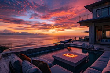 Canvas Print - a fire pit in a pool with a sunset in the background