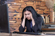 Businesswoman having headache in office suffer from company crisis