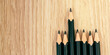 An 2B Pencils or black pencil with wooden background, desk or floor, concept of education stationary with copy space, creativity, imagination, classroom, school supplies ideas, back to school banner.