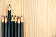 An 2B Pencils or black pencil with wooden background, desk or floor, concept of education stationary with copy space, creativity, imagination, classroom, school supplies ideas, back to school banner.