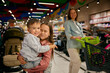 Happy family in shopping mall portrait with adorable children