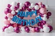 Festive Happy Birthday Balloons Decoration in Pink and Blue Theme.