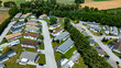 © Greg Kelton - Aerial view of suburban Mobile, Prefab, Manufactured, home park, rows homes, neatly trimmed lawns