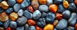 Vibrant Colored Beach Pebbles on a Striking K Background