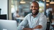 © starush - A smiling man in a business suit sitting at his desk with laptop, AI