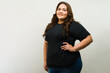 T-shirt mockup of a fat woman wearing a black shirt against a white background