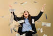 Excited plus-size businesswoman in office attire with flying money in a studio setting