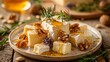 Cheese plate with drizzled honey and a selection of tasty nuts