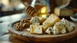 Gourmet cheese plate with honey and nuts - delicious snack platter for events and entertaining