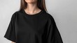 © MUCHIB - A woman wears an oversized black shirt. dark streetwear outfit young girl. Girl in stylish total black outfit mock-up.