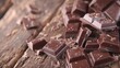 Chocolate (selective focus) on an old wooden table (close-up shot)