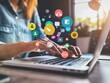 © Narongsak - A woman is typing on her laptop. She is surrounded by social media icons. The concept of social media marketing.
