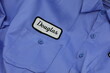 © Douglas - Employee Uniform shirt with name tag patch over pocket