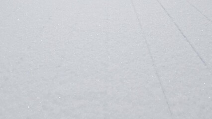 Wall Mural - lines on surface of white groomed snow on winter ski slope background