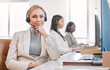 © peopleimages.com - Call center, portrait and woman in office, confidence and smile for customer service, headset and tech support. Team, working and b2b for telemarketing, help and consulting for company and people
