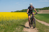 Man on a bicycle.