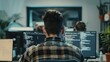© Media Srock - a group man of developers with monitors showing lines of code in the office