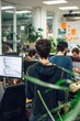 © Media Srock - a group man of developers with monitors showing lines of code in the office