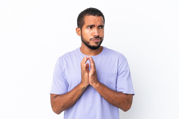 Wall Mural - Young Ecuadorian man isolated on white background scheming something