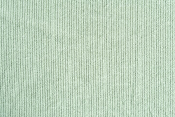 Wall Mural - Clothing fabric green texture background, close up of cloth textile surface abstract.