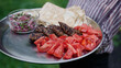 grilled lamb kebab meat serving on a steel plate