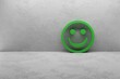 © tl6781 - green positiv smiley in a white concrete room