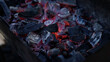 Handheld shot of charcoal in brazier, preparation for bbq