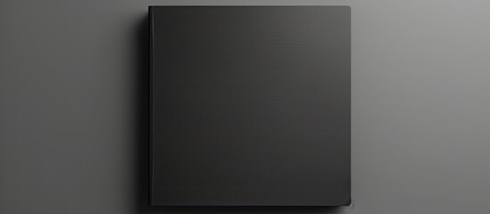 Aufkleber - Minimal design concept featuring a mockup photo of a blank black notebook with a copy space image The notebook sits on a black table allowing for customization with a blank cover template