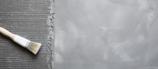 Aufkleber - Gray concrete background with a roll of mesh for plastering and a putty knife seen from a top down perspective Copy space image available