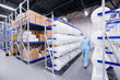 Concept medicine factory for production health. Worker of warehouse on roll non woven medical material