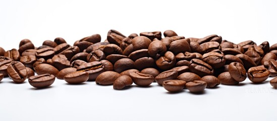 Wall Mural - Image of roasted coffee beans with a textured background isolated on a white backdrop Includes copy space for text