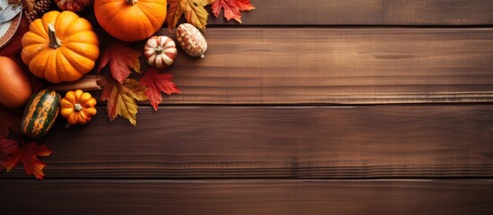Poster - Copy space image of a Thanksgiving table setting with cutlery on a wooden background evoking the warm colors and cozy atmosphere of autumn