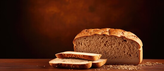 Wall Mural - Copy space image of whole wheat bread on a brown background