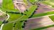 Curvy countryside road in Ponidzie region of Poland. Aerial drone view