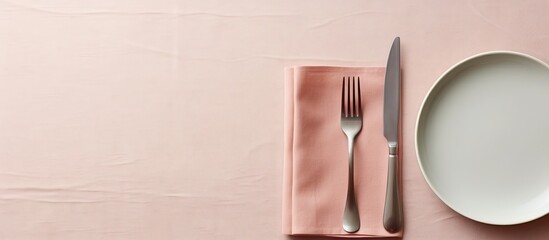 Poster - A minimal style table setting for Easter spring with fork knife and napkin The background features a close up top down view with ample copy space