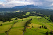 Countryside fields and scenic landscape in Podhale region of Poland. Aerial drone view.