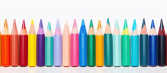 Aufkleber - A vibrant array of wax crayons arranged on a white background seen from a captivating perspective with ample space for copying Each crayon is labeled with its respective color name