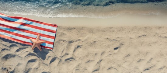 Aufkleber - Top view of beach accessories and towel on a sandy beach with ample space for text A perfect image to capture the essence of a summer vacation