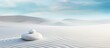 Zen harmony concept with a white stone resting on the sandy ground The top view perspective creates a serene backdrop in this horizontal banner Copy space image