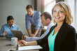 © peopleimages.com - Meeting, notes and portrait of woman writing agenda on paper or planner in office. Happy, business people and project manager with reminder of teamwork, planning and schedule for collaboration