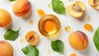 Apricot kernel oil with a fruity scent displayed on a white background from above