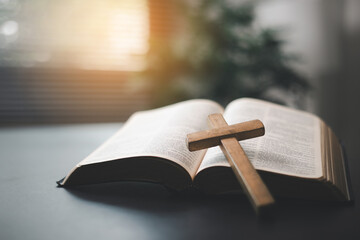 Sticker - Holy Bible on the wooden table, Vintage church with the Bible against a black background, seekers find holy knowledge through prayer, connecting with God in reverence and devotion.