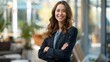 © Tatiana - A woman in a business suit is smiling and posing for a photo