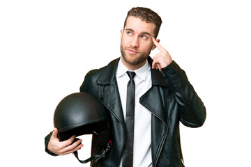 Wall Mural - Business man with a motorcycle helmet over isolated chroma key background having doubts and thinking