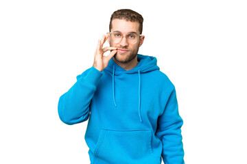 Wall Mural - Young handsome blonde man over isolated chroma key background showing a sign of silence gesture