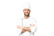 © luismolinero - Young blonde man Chef over isolated chroma key background keeping the arms crossed in frontal position