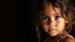 Portrait of indigenous Australian child on black background