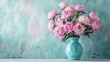 Bouquet of pink Sarah Bernhardt peonies arranged in a turquoise vase on a white table