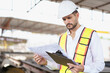 © DG PhotoStock - Hispanic male engineer working at construction site.